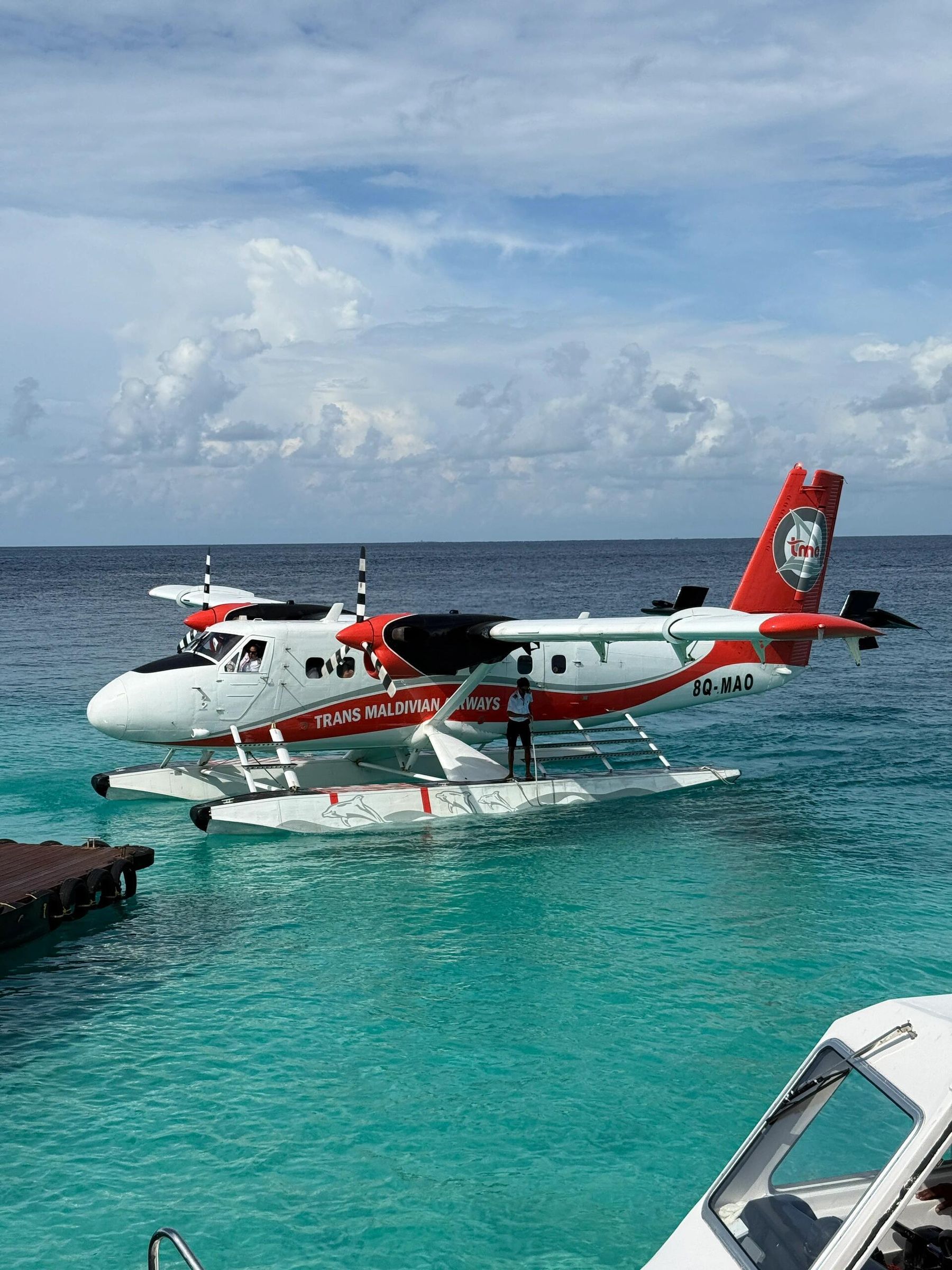 Seaplane over Maldives turquoise atolls